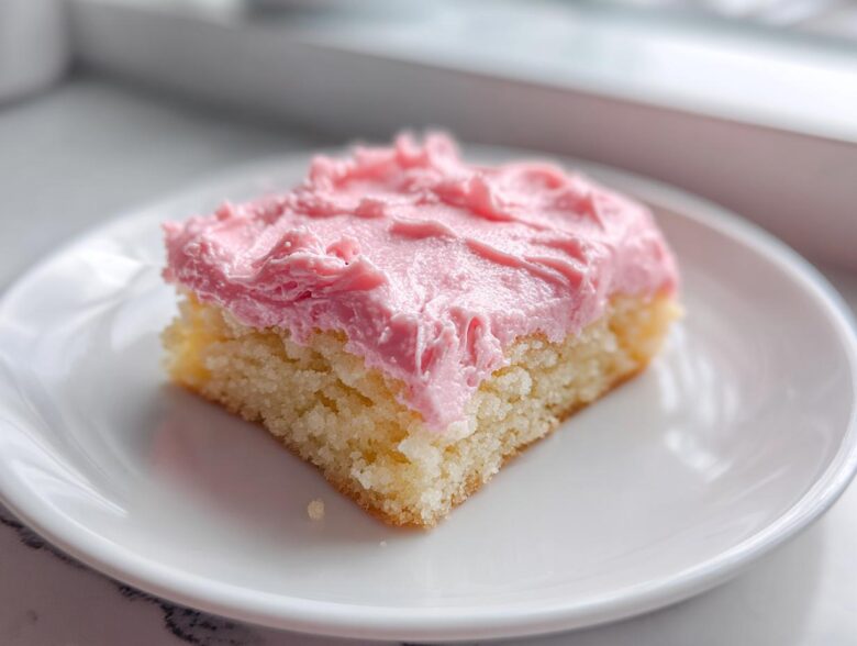 Close-up of a square slice of Copycat Crumbl Sugar Cookie with thick, bright pink frosting.