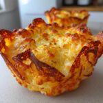 Close-up of a golden brown, crispy Keto Crispy Cheese Taco Shell Bowl fresh from the oven.