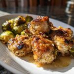 Close-up of perfectly cooked Sheet Pan Garlic Butter Chicken and Brussels Sprouts with a rich glaze.